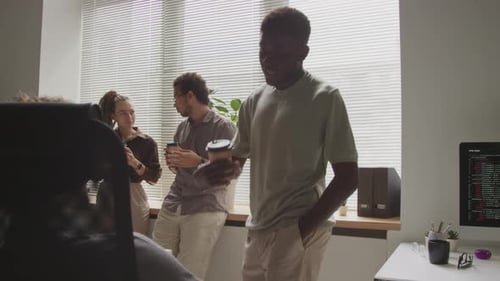 Young Adults Talking in Modern Office