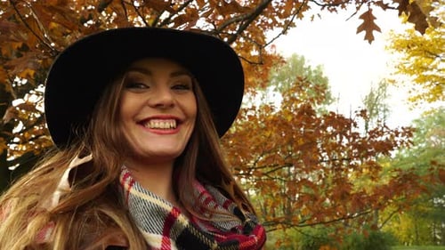 Woman Relaxing In Autumn Park