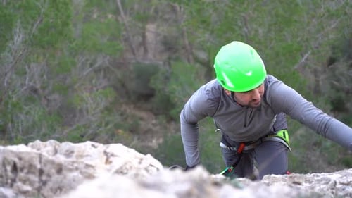 Via ferrata ascension by group of sportsmen drone aerial view of mountain and mountaineers climbing