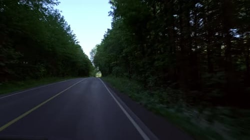 Car driving through a small rural road