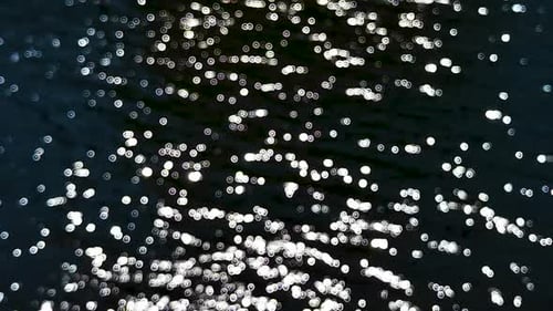 Abstract Water Surface with Sparkling Light Reflections