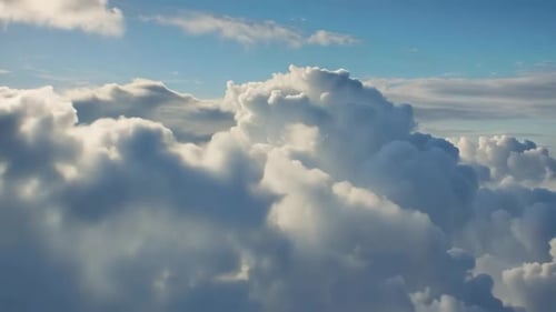 Flying Through Fluffy White Volumetric Clouds in Clear Blue