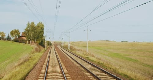 Traveling Railroad Tracks Through Rural Countryside