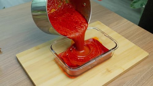 Cooking Video. Close up of food preparation placing ingredients in to a pan ready for cooking and sh