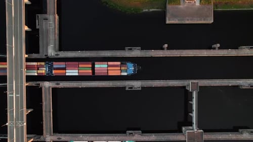 Container Ship Navigating Through Krammer Locks At Philipsdam In Bruinisse, Netherlands. aerial topd