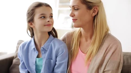 Mother and Daughter Smiling and Laughing Together