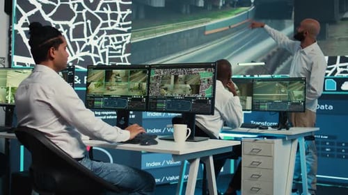 Team of Employees Monitoring Delivery Trucks with Gps Coordinates
