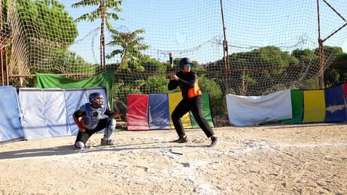 Baseball Batter Swinging and Missing the Ball