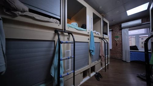 Capsule Hotel Room Showing Individual Sleeping Boxes Offering Privacy and Convenience