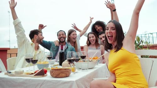 Friends Celebrate with Food and Wine on Terrace