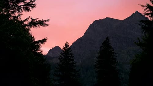 Pink sunset over Mount Cannon in Glacier National Park, time lapse