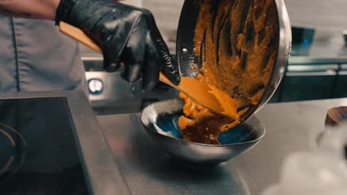 restaurant chef serves freshly prepared delicious curry in a plate professional Asian cuisine