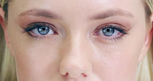 4k video footage of an attractive young woman's eye's in the studio