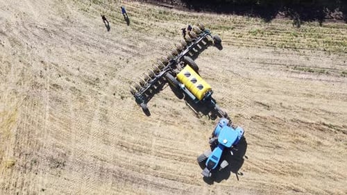 Blue Tractor O.A. Planting Canola On No Till Field
