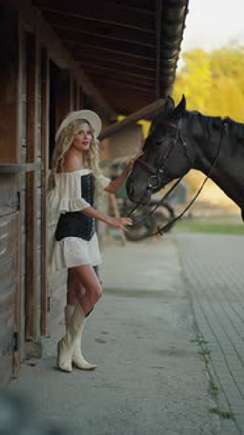 Woman With Horse at Stable