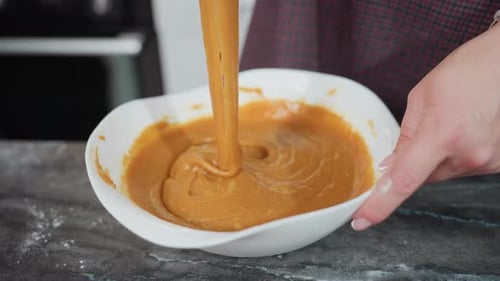 Close Up of Mixing Batter in Bowl with Whisk