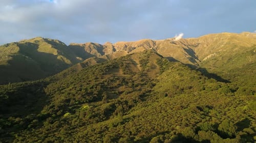 Stunning aerial drone footage capturing lush vegetation, mesmerizing cloud and mountain landscapes i