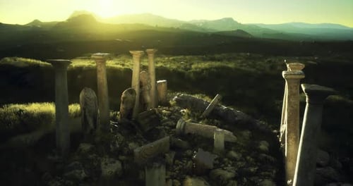 Ancient Columns Stand Tall Under a Golden Sunrise in a Serene Valley