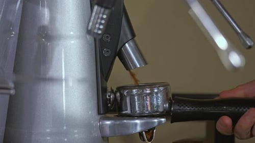 Filling Portafilter with Ground Coffee from Machine