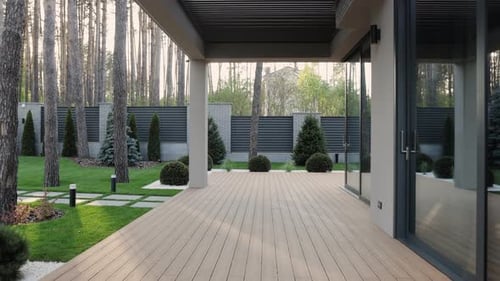 Wooden Terrace Near Modern House in Summer in Landscaped Front Garden Terrace with Wooden Floor