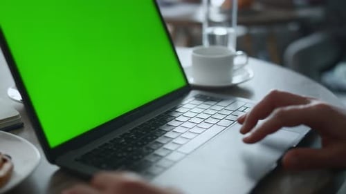 Businessman Hands Using Keyboard Laptop Green Screen Working Online in Cafe. Unknown