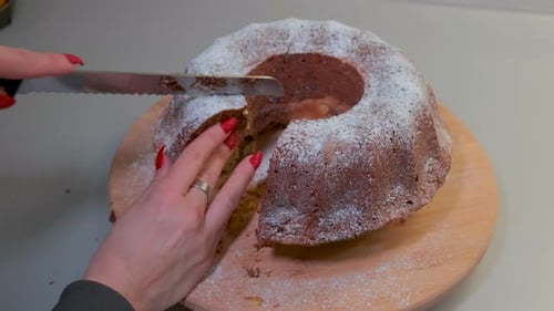 Cutting a slice of marble cake