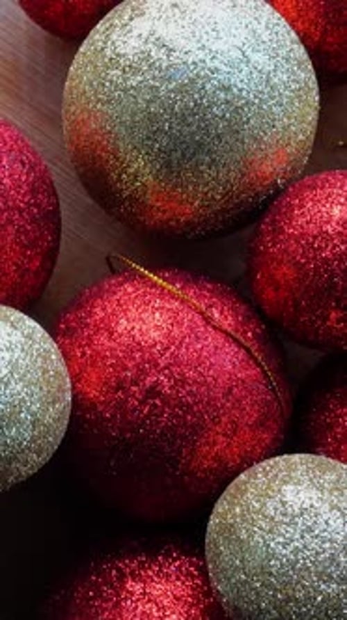 Sparkly Red and Gold Christmas Ornaments Close Up