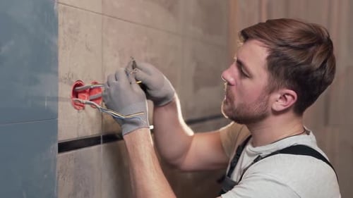 the electrician connects the socket