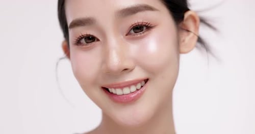 Slow motion of beautiful young Asian girl with k-beauty make up style.