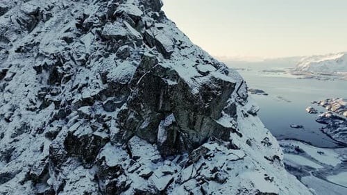 Cold Winter's Day with a Mountain Peak Draped in Snow Against a Backdrop of Vivid Blue Skies Mount