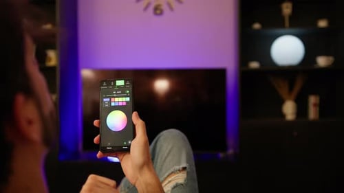 Man Changing Colors with Phone Application