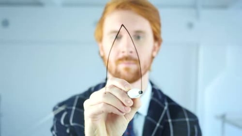 Creative Man Drawing Startup Rocket Concept on Transparent Glass Red Hairs