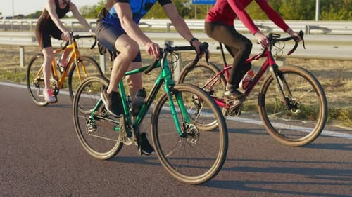 Sport People Practising in Cycling on Asphalt Road