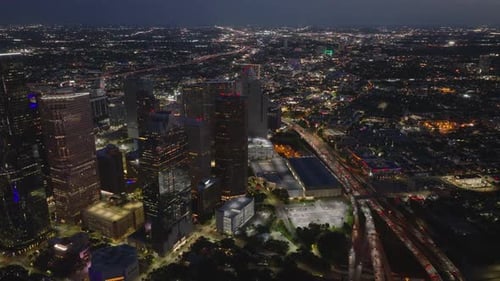 High Altitude View of Houston at Night City Lights Illuminating Skyscrapers and Streets Against Dark