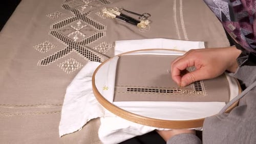 Close-up Embroidering a Geometric Pattern on Fabric