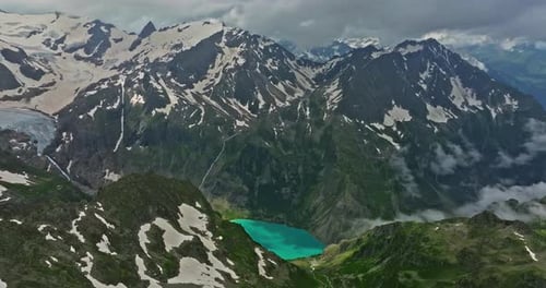 Ancient Snow Glacier Among High Mountains The Peaks of the Mountains are Covered with Snow