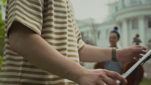 Musical Ensemble Practicing Outdoors in Front of Building