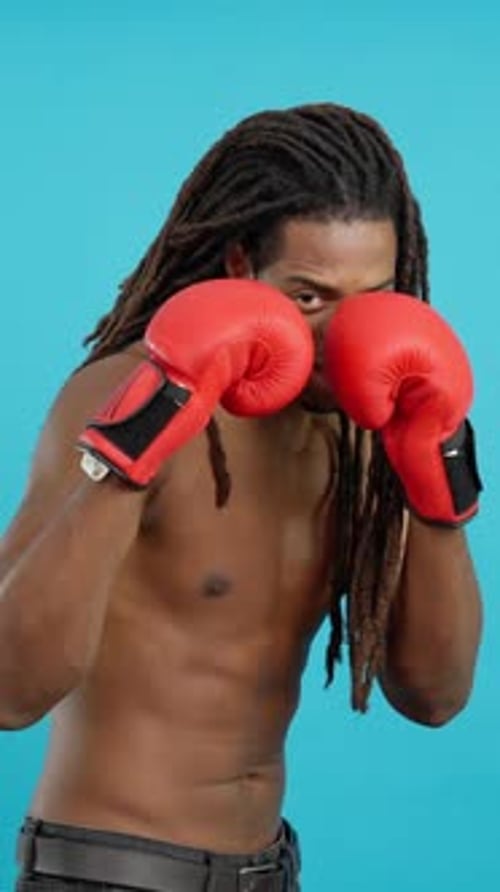 Man with Dreadlocks Boxing in Portrait Orientation