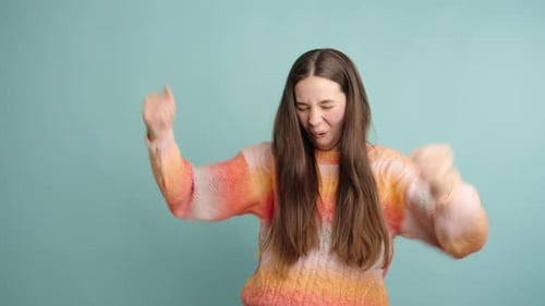 Woman Cheering with Fists in the Air