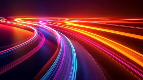 Abstrakte Lichtspuren auf einer kurvenreichen Straße