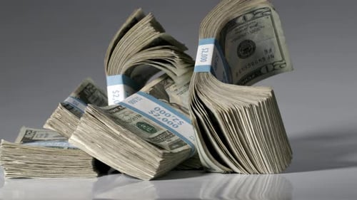 Money Falling On To A Table