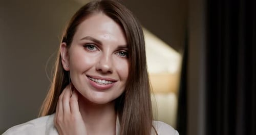 Woman with Braces Smiling at the Camera