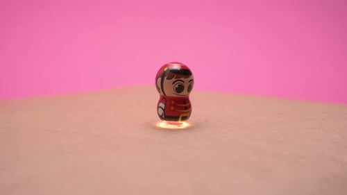 Cartoon Figurine Still Life on Pink Background