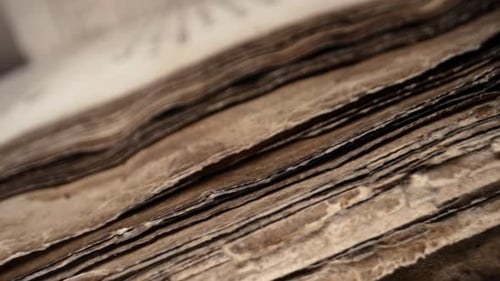Slider Macro View of Ancient Papyrusarchival manuscriptsMedieval Library Tomes