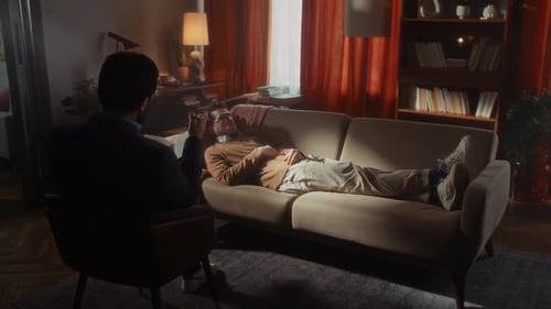 Man Lying on Couch Talking in Therapy Session