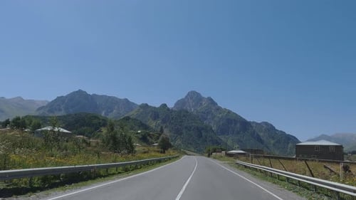Scenic Drive through Rural Mountain Landscape