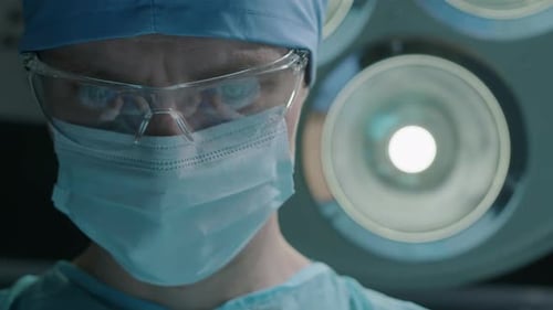 Close Up of Male Surgeon Performing Operation
