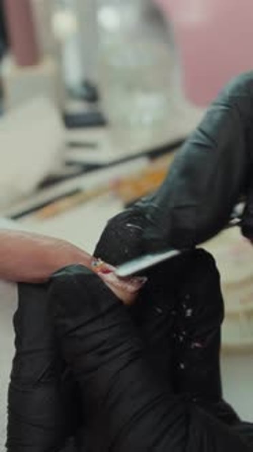Filing Decorated Nail in Nail Salon