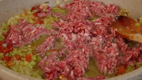 Adding Raw Ground Beef to Sauteed Peppers and Onions