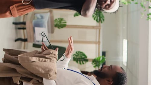 Vertical Video Customers Shop in Stylish Clothing Store